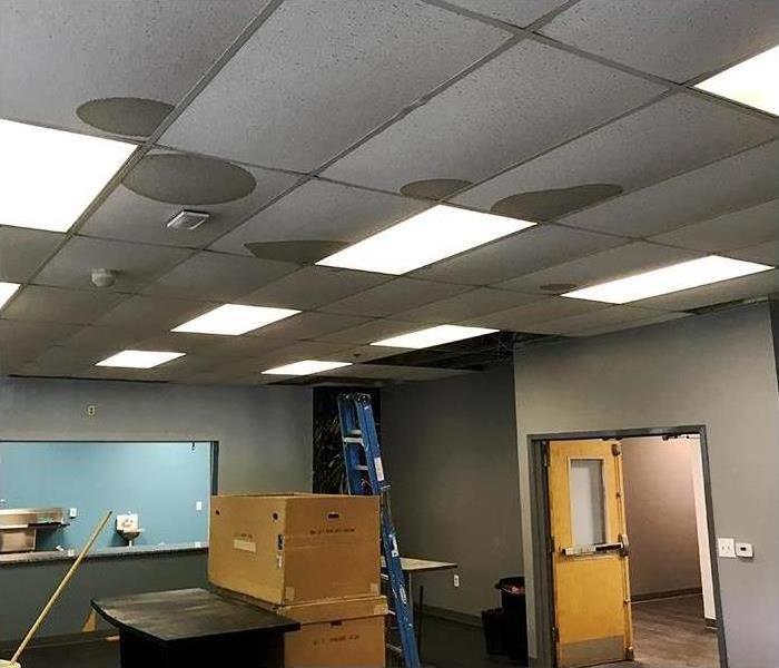 water damage to ceiling, walls and floor of commercial interior