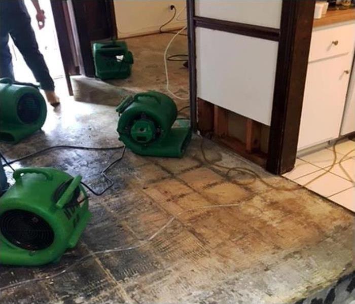 water damage floor and drying equipment during property repairs